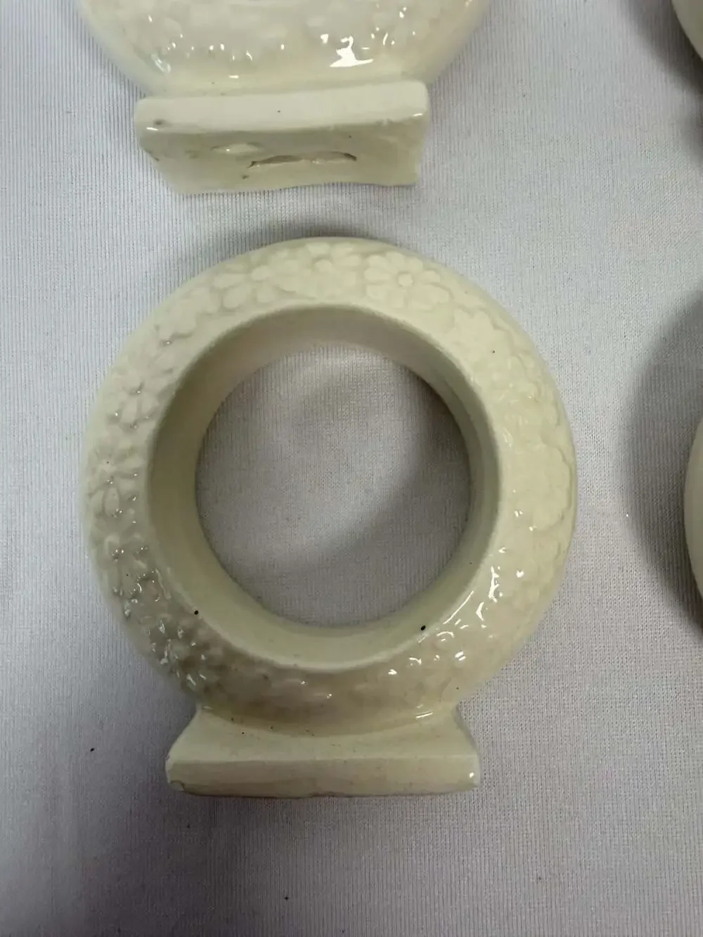 Set of 4 Vintage White Ceramic Floral Embossed Standing Napkin Rings